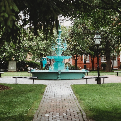Decorative fountain in a tree-lined park in Chestertown, Maryland.