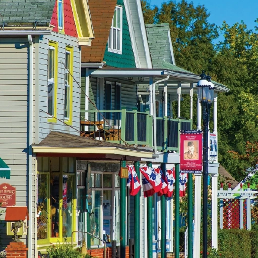 Row of vibrant, colorful shops in downtown Rock Hall, Maryland.