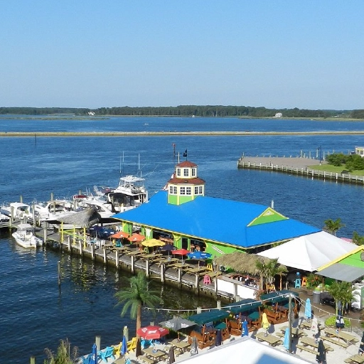 Waterfront dock bar in Grasonville, Maryland, with outdoor seating overlooking the Kent Narrows