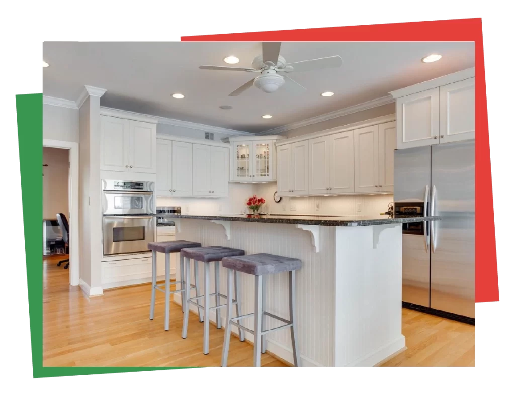 Modern white kitchen with freshly painted cabinets and sleek finishes in a Kent County home.